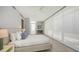 A spacious bedroom with a minimalist design and lots of natural light at 280 Golden Gate Pt # 400, Sarasota, FL 34236