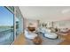 Bright living room featuring floor-to-ceiling windows with waterfront views and modern decor at 280 Golden Gate Pt # 400, Sarasota, FL 34236