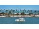 Boat with waterfront view featuring palm trees at 280 Golden Gate Pt # 400, Sarasota, FL 34236