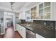 Well-lit kitchen featuring modern appliances, stylish backsplash, and ample cabinet space at 3042 Lockwood Ter, Sarasota, FL 34231