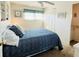 Comfortable bedroom with a ceiling fan, closet, and neutral-colored walls at 3335 Spanish Oak Ter, Sarasota, FL 34237