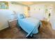 Cozy bedroom with a single bed, cool color scheme, and a view of the entrance to the unit at 3335 Spanish Oak Ter, Sarasota, FL 34237