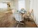 Cozy dining area with glass table and seating for four at 3335 Spanish Oak Ter, Sarasota, FL 34237
