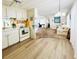 Open concept kitchen/living area with hard wood flooring at 3335 Spanish Oak Ter, Sarasota, FL 34237
