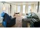 A comfortable living room with natural light and neutral tones at 3335 Spanish Oak Ter, Sarasota, FL 34237