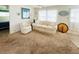 Bright living room with comfortable seating, natural light, and a cozy atmosphere for relaxation at 3335 Spanish Oak Ter, Sarasota, FL 34237