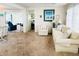Comfortable living room with plush seating, soft lighting, and a glimpse into other rooms at 3335 Spanish Oak Ter, Sarasota, FL 34237