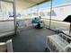 Enclosed porch area perfect for relaxation, featuring a neutral color scheme and ample seating at 3335 Spanish Oak Ter, Sarasota, FL 34237