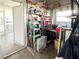 Versatile storage area featuring shelving, a workbench, and a well-organized space for various tools at 3335 Spanish Oak Ter, Sarasota, FL 34237