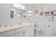 Bright bathroom featuring a white vanity, decorative wall art, and modern fixtures at 347 Montgomery Ave, Sarasota, FL 34243