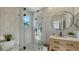 Modern bathroom featuring a glass-enclosed shower and a stylish wood vanity at 3540 Mistletoe Ln, Longboat Key, FL 34228