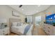 Bright bedroom with light wood furniture, calming decor, and balcony access at 3540 Mistletoe Ln, Longboat Key, FL 34228