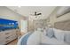 Comfortable bedroom with two beds, a dresser, and a ceiling fan at 3540 Mistletoe Ln, Longboat Key, FL 34228