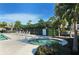 Hot tub in the community pool area featuring tropical landscaping and sunny skies at 3540 Mistletoe Ln, Longboat Key, FL 34228