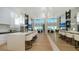 Open-concept kitchen and living room with island seating and modern finishes at 3540 Mistletoe Ln, Longboat Key, FL 34228