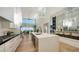 Modern kitchen with an island, stainless steel appliances and views of the living area at 3540 Mistletoe Ln, Longboat Key, FL 34228