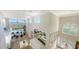 Open-concept living area with a pool view and a dining area with floor-to-ceiling mirror at 3540 Mistletoe Ln, Longboat Key, FL 34228