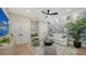 Comfortable living area with stylish floral wallpaper, modern lighting, and neutral color scheme at 3540 Mistletoe Ln, Longboat Key, FL 34228