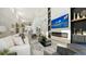 Spacious living room with modern fireplace, elegant furnishings, and an open layout design at 3540 Mistletoe Ln, Longboat Key, FL 34228