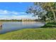 Scenic view of a lake with a condominium complex in the background at 3698 Lake Bayshore Dr # K-410, Bradenton, FL 34205