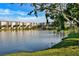 Picturesque view of a lake with a multi-story condominium building at 3698 Lake Bayshore Dr # K-410, Bradenton, FL 34205