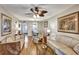 Cozy living room with neutral tones, ceiling fan, with a view of dining area, perfect for relaxation and entertaining at 3698 Lake Bayshore Dr # K-410, Bradenton, FL 34205