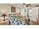 Comfortable bedroom with ceiling fan, ensuite bathroom, and serene decor at 3698 Lake Bayshore Dr # K-410, Bradenton, FL 34205
