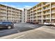 Exterior view showing assigned parking spots for residents of the condo building K at 3698 Lake Bayshore Dr # K-410, Bradenton, FL 34205