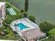 This aerial shot features a community pool, shuffleboard, and waterfront views, promising recreation and relaxation at 3698 Lake Bayshore Dr # K-410, Bradenton, FL 34205