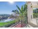 Exterior balcony with a decorative wrought iron railing boasts waterfront views at 3935 N Shell Rd, Sarasota, FL 34242