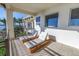 Sunny balcony with two chaise lounges and ocean view at 3935 N Shell Rd, Sarasota, FL 34242