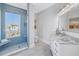 Stylish bathroom with a glass-enclosed shower, elegant vanity, and calming color palette at 3935 N Shell Rd, Sarasota, FL 34242