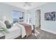 Light blue bedroom featuring beautiful ocean views and a walk-out balcony at 3935 N Shell Rd, Sarasota, FL 34242