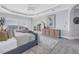 Bedroom featuring a sliding glass door with balcony access, ocean views, and light gray walls at 3935 N Shell Rd, Sarasota, FL 34242