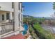 Stunning home exterior with a pool, waterfall feature, lush landscaping, and ocean views at 3935 N Shell Rd, Sarasota, FL 34242