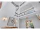 Elegant foyer with high ceilings, decorative lighting, and an impressive stairway at 3935 N Shell Rd, Sarasota, FL 34242