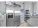 Modern kitchen featuring stainless steel appliances and light gray cabinets and countertops at 3935 N Shell Rd, Sarasota, FL 34242