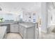 Bright kitchen with a breakfast bar, modern fixtures, and an ocean view at 3935 N Shell Rd, Sarasota, FL 34242