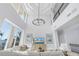 Bright living room with high ceilings, water views, and stylish decor at 3935 N Shell Rd, Sarasota, FL 34242