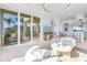Open concept living area showcasing ocean views and access to outdoor living space at 3935 N Shell Rd, Sarasota, FL 34242