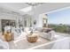 Bright, open living room with ocean views, elegant furniture, and seamless indoor-outdoor flow at 3935 N Shell Rd, Sarasota, FL 34242