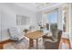 Bright office space with modern furniture and a large window offering picturesque outdoor views at 3935 N Shell Rd, Sarasota, FL 34242