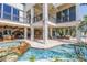 Luxurious outdoor area with a pool, spa, bar and a waterfall feature at 3935 N Shell Rd, Sarasota, FL 34242