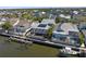 Aerial view showcases waterfront property with private dock, pool, and outdoor living spaces at 428 Islebay Dr, Apollo Beach, FL 33572