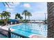 Large community pool with lap lanes, ample seating, and waterfront views at 428 Islebay Dr, Apollo Beach, FL 33572