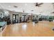 Gym featuring hardwood floors, fitness equipment, weights, and mirrors at 428 Islebay Dr, Apollo Beach, FL 33572