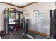 A gym area has weight racks, training posters and equipment at 428 Islebay Dr, Apollo Beach, FL 33572
