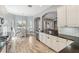 Well-lit kitchen with a breakfast nook, stainless steel appliances, and ample counter space at 428 Islebay Dr, Apollo Beach, FL 33572