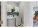 Convenient laundry room with modern washer and dryer units and ample storage space at 428 Islebay Dr, Apollo Beach, FL 33572