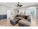 Spacious living room with hardwood floors, modern decor, and an open layout connecting to the kitchen at 428 Islebay Dr, Apollo Beach, FL 33572
